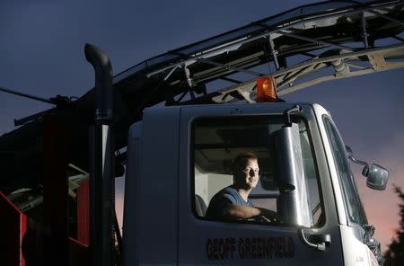 Heavy goods vehicle driver Philip Francis poses for a photograph at the Geoff Greenfield yard in Upper Beeding, near Steyning in southern England July 21, 2014. REUTERS/Luke MacGregor