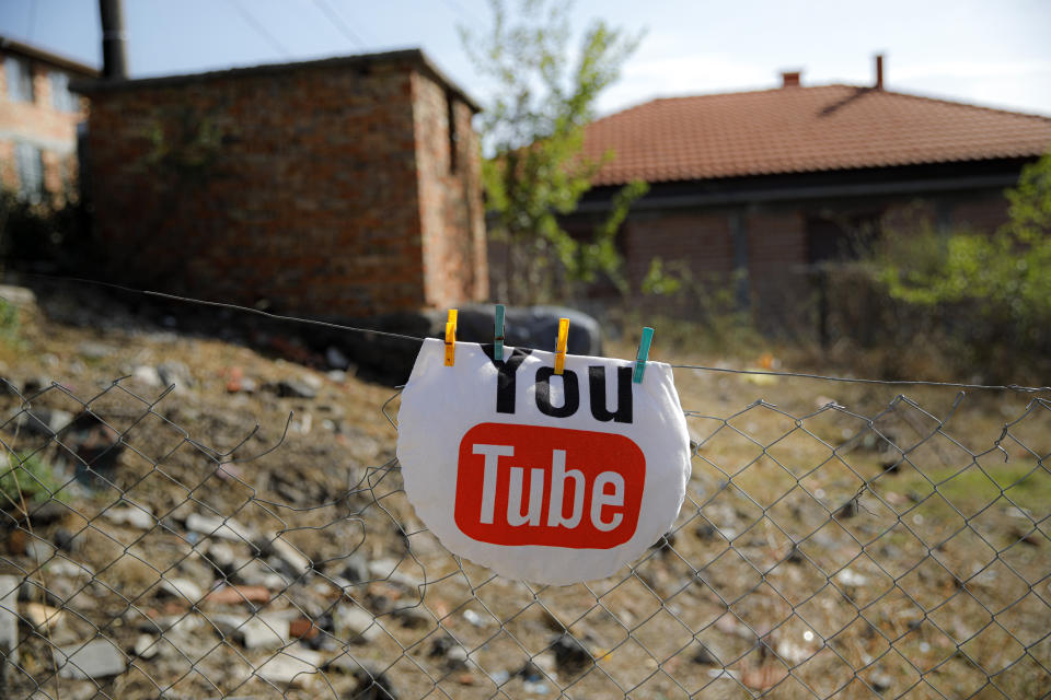 A pillow hangs on a fence to dry in the yard of the Topchu family house in a village on the outskirts of Burgas, Bulgaria, Monday, Sept. 28, 2020. Human rights activists and experts say local officials in several countries with significant Roma populations have used the pandemic to unlawfully target the minority group, which is Europe's largest and has faced centuries of severe discrimination. (AP Photo/Vadim Ghirda)