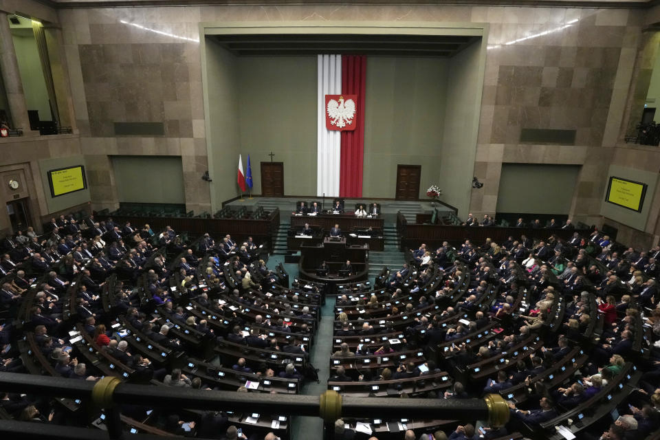 Newly elected Poland's Prime Minister Donald Tusk addresses lawmakers during his speech at the parliament in Warsaw, Poland, Tuesday Dec. 12, 2023. (AP Photo/Czarek Sokolowski)