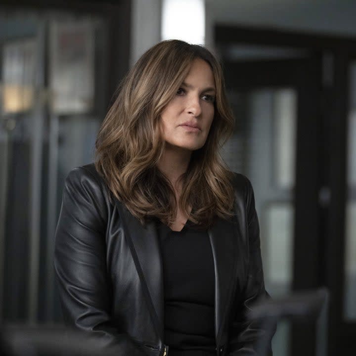 Detective Benson looking at something seriously