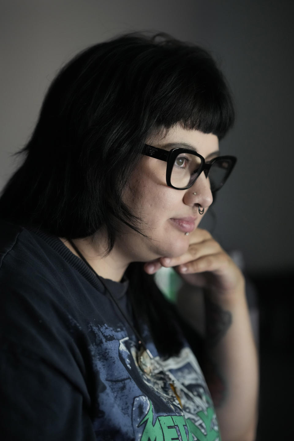 Beka Favela sits for a portrait at her Westmont, Ill., apartment, Tuesday, June 20, 2023. After a payment pause that has lasted more than three years, more than 40 million student loan borrowers will be on the hook for payments starting in the fall. (AP Photo/Charles Rex Arbogast)