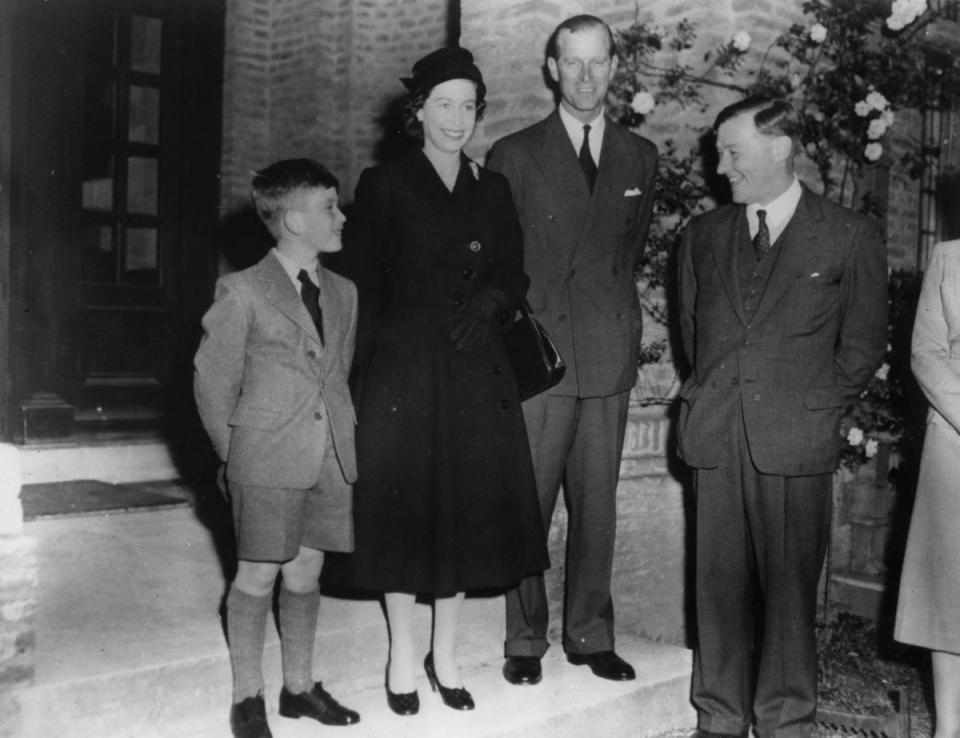 Prince Charles, with the Queen and the Duke of Edinburgh, meets his headmaster on his first day at Cheam School (PA) (PA Archive)