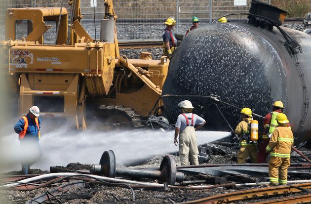 Firefighters spray wagons at the site of the train wreck in Lac-Megantic July 14, 2013. (Photo: Mathieu Belanger via Reuters)