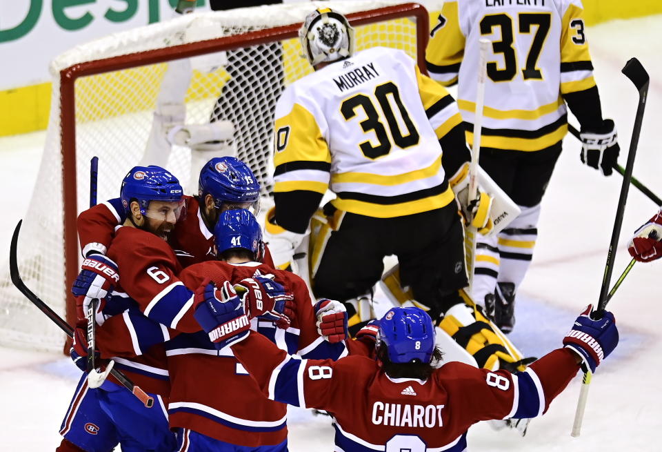 Montreal Canadiens' Shea Weber (6) celebrates his goal on Pittsburgh Penguins goaltender Matt Murray (30) with teammates during first period NHL Eastern Conference Stanley Cup playoff action in Toronto on Wednesday, Aug. 5, 2020. (Frank Gunn/The Canadian Press via AP)