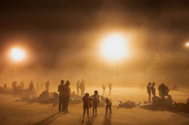 PHOTO: Migrants wait to be picked up by U.S. Customs and Border Protection officers near the U.S. Border wall near El Paso, Texas, May 10, 2023. (Reuters)