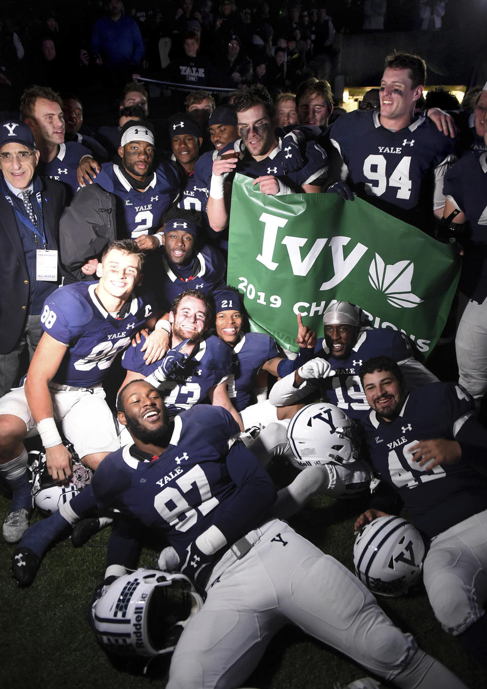 Yale players celebrate winning the Ivy League after their 50-43 double overtime victory against Harvard in an NCAA college football game at the Yale Bowl, Saturday, Nov. 23, 2019, in New Haven, Conn. (Arnold Gold/New Haven Register via AP)