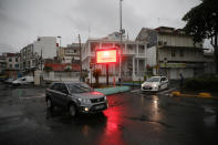 <p>A car passes next to a banner warning of a “Red Alert” for rains as Hurricane Maria approaches in Pointe-a-Pitre, Guadeloupe island, France, Sept. 18, 2017. (Photo: Andres Martinez Casares/Reuters) </p>