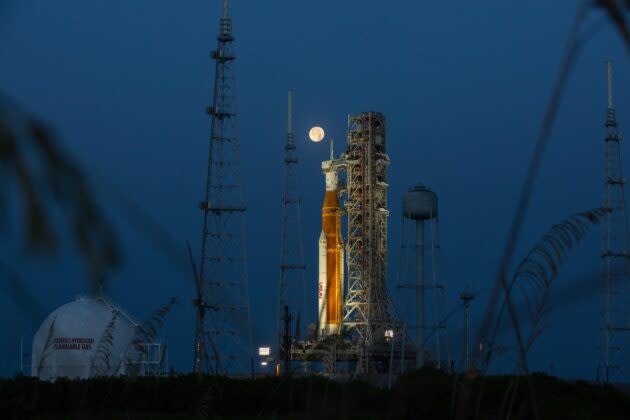 A full moon shines above NASA’s Space Launch System rocket during pad testing on June 14. (NASA Photo)