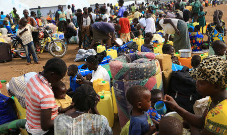 South Sudanese refugee families displaced by fighting gather at Imvepi settlement in Arua district, northern Uganda, April 4, 2017. Picture taken April 4, 2017. REUTERS/James Akena