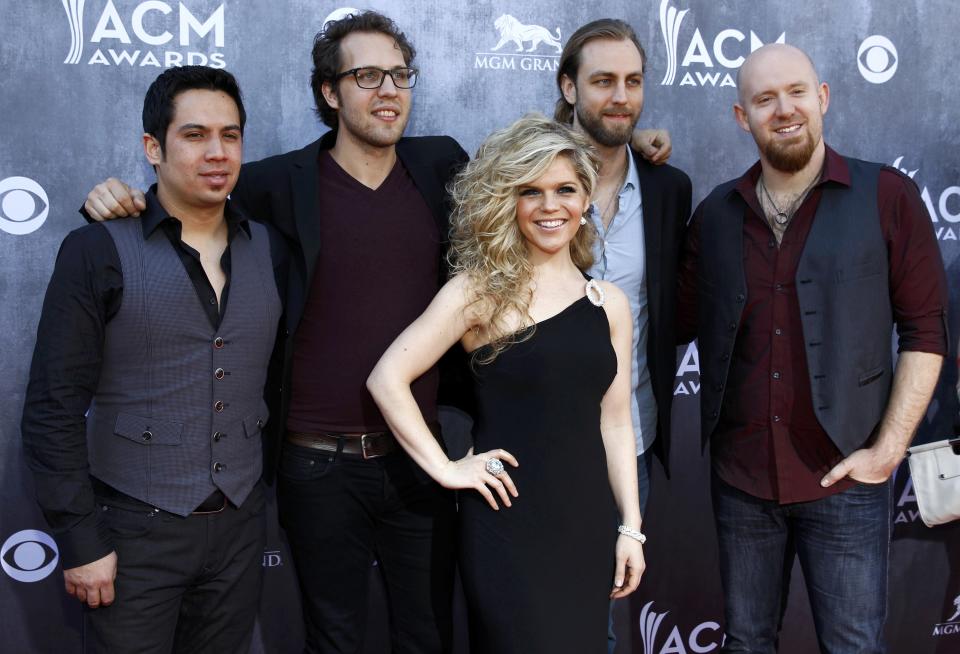 Country music band Natalie Stovall and The Drive pose as they arrive at the 49th Annual Academy of Country Music Awards in Las Vegas, Nevada April 6, 2014. REUTERS/Steve Marcus (UNITED STATES - Tags: ENTERTAINMENT) (ACMAWARDS-ARRIVALS)
