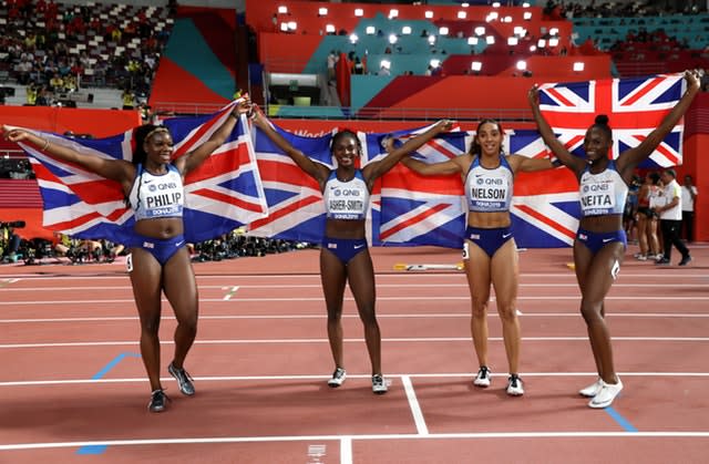 Asha Philip, Dina Asher-Smith, Ashleigh Nelson and Daryll Neita celebrate their silver medal