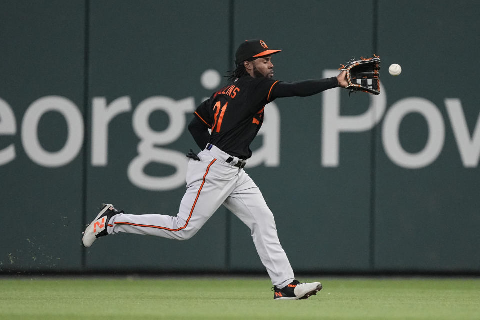Baltimore Orioles center fielder Cedric Mullins (31) runs down a ball hit for a single by Atlanta Braves' Vaughn Grissom in the eighth inning of a baseball game Saturday, May 6, 2023, in Atlanta. (AP Photo/John Bazemore)