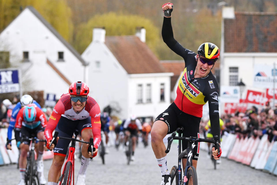 NOKERE BELGIUM  MARCH 15 Tim Merlier of Belgium and Team Soudal  Quick Step celebrates at finish line as race winner ahead of Edward Theuns of Belgium and Team Trek  Segafredo during the 77th Danilith Nokere Koerse 2023 Mens Elite a 1936km one day race from Deinze to Nokere  DanilithNokereKoerse  on March 15 2023 in Deinze Belgium Photo by Luc ClaessenGetty Images