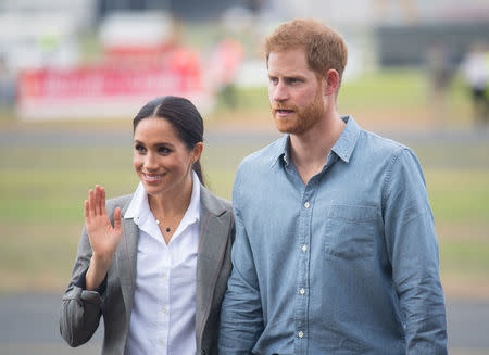 Britain's Prince Harry and Meghan, Duchess of Sussex attend the naming and unveiling of a new Royal Flying Doctor Service aircraft at Dubbo City Regional Airport, in Dubbo, New South Wales, on the second day of the royal couple's visit to Australia. Wednesday October 17, 2018. Dominic Lipinski /Pool via REUTERS