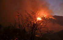 <p>A wildfire burns in the hills near Placenta Canyon Road in Santa Clarita, Calif., July 24, 2016.(AP Photo/Ringo H.W. Chiu)</p>