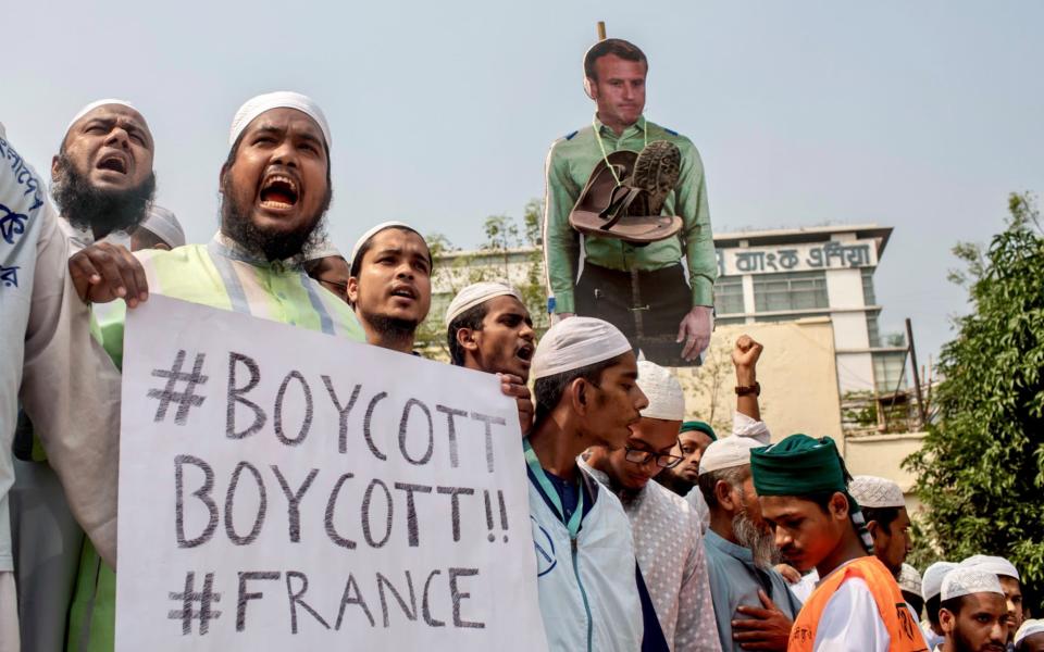 Supporters and activists of the Islami Andolan Bangladesh take part in a protest calling for the boycott of French products  -  REUTERS