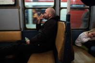 NEW YORK, NY - DECEMBER 16: A man sits in a vintage New York City subway car as it pulls into a station on December 16, 2012 in New York City. The New York Metropolitan Transportation Authority (MTA) runs vintage subway trains from the 1930's-1970's each Sunday along the M train route from Manhattan to Queens through the first of the year. (Photo by Preston Rescigno/Getty Images)