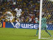 France's Paul Pogba (2nd L) attempts to score a header against Ecuador's goalkeeper Alexander Dominguez but misses, during their 2014 World Cup Group E soccer match at the Maracana stadium in Rio de Janeiro June 25, 2014. REUTERS/Kai Pfaffenbach (BRAZIL - Tags: SOCCER SPORT WORLD CUP)