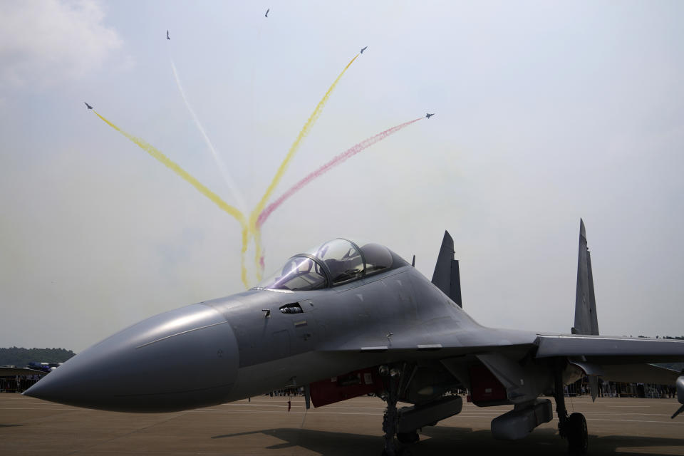 Fighter jets fly past a Chinese military's J-16D electronic warfare airplane during 13th China International Aviation and Aerospace Exhibition, also known as Airshow China 2021, on Wednesday, Sept. 29, 2021, in Zhuhai in southern China's Guangdong province. China flew 39 warplanes, including 24 J-16s and 10 J-10s, toward Taiwan, Sunday, Jan. 23, 2022, in its largest such sortie of the new year, continuing a pattern that the island has answered by scrambling its own jets in response. (AP Photo/Ng Han Guan)