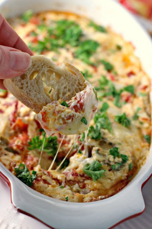 <p>Karen's Kitchen Adventures</p><p>You had us at hot pepperoni and muffuletta and dip! Fans of the classic Louisiana sandwich are going to love this ooey-gooey appetizer. </p><p><strong>Get the recipe:</strong><a href="https://www.reneeskitchenadventures.com/2014/12/hot-pepperoni-muffuletta-dip.html" rel="nofollow noopener" target="_blank" data-ylk="slk:Hot Pepperoni Muffaletta Dip;elm:context_link;itc:0;sec:content-canvas" class="link rapid-noclick-resp"><strong> Hot Pepperoni Muffaletta Dip</strong></a></p>