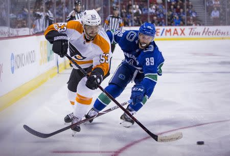 Dec 7, 2017; Vancouver, British Columbia, CAN; Vancouver Canucks winger Sam Gagner (89) attempts to check Philadelphia Flyers defenseman Shayne Gostisbehere (53) at Rogers Arena. Mandatory Credit: Bob Frid-USA TODAY Sports