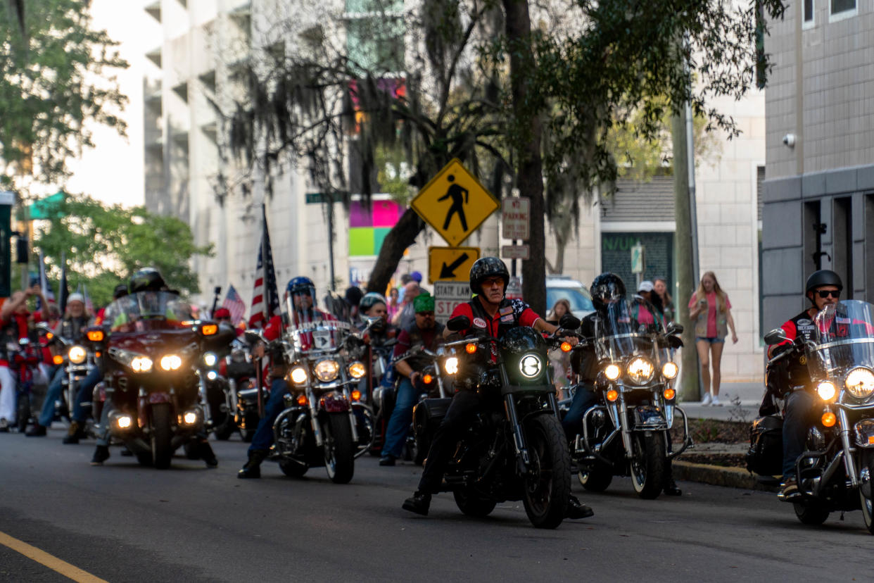 A veteran biker group heads east on Oglethorpe Street towards the parade's end.