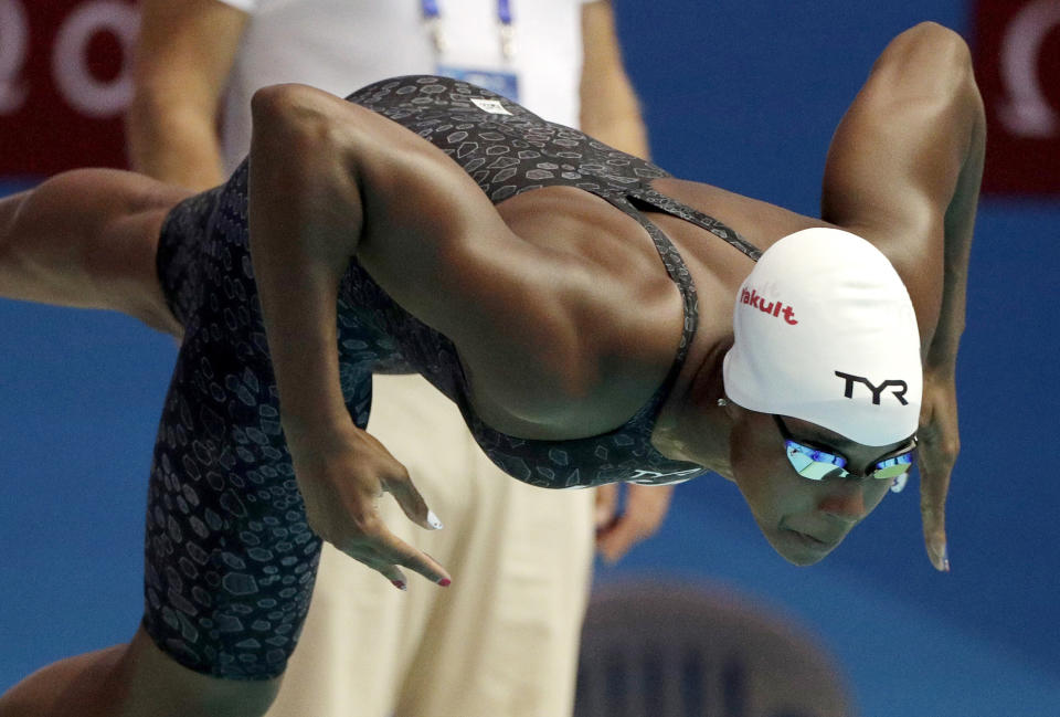 FILE - In this July 27, 2019, file photo, United States' Simone Manuel starts a heat of the women's 50-meter freestyle at the World Swimming Championships in Gwangju, South Korea. (AP Photo/Mark Schiefelbein, File)