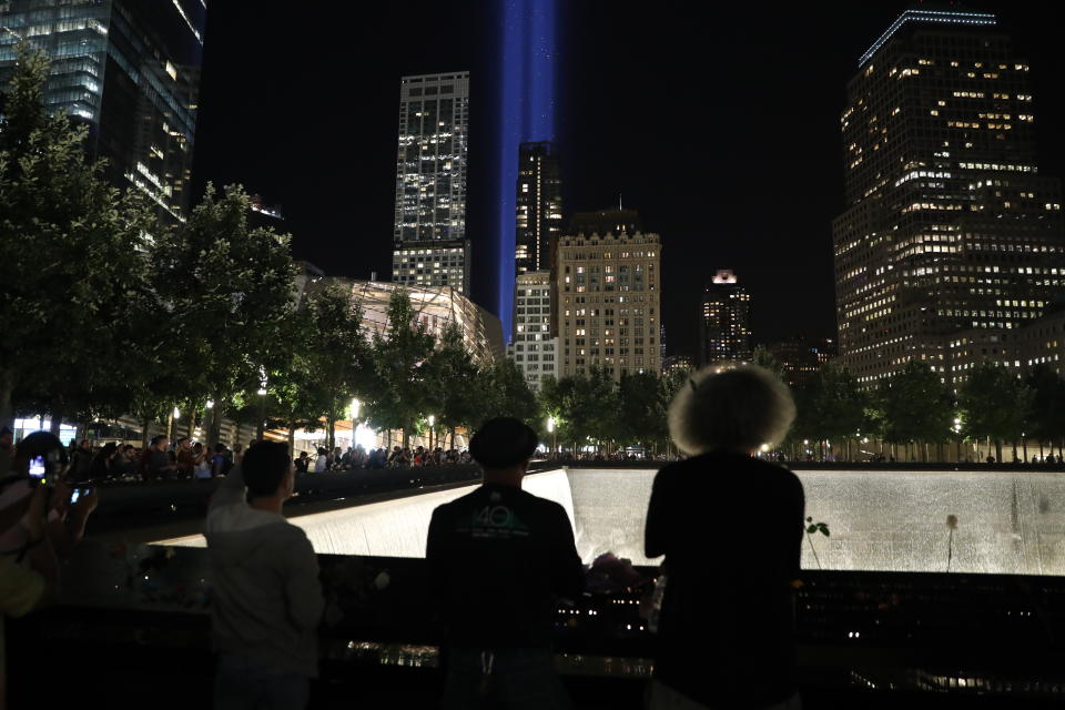 <p>Visitors take photos of ‘The Tribute in Light’ at the National September 11 Memorial & Museum on Sept. 11, 2017. (Gordon Donovan/Yahoo News) </p>