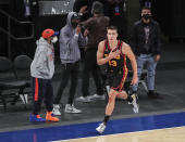Atlanta Hawks guard Bogdan Bogdanovic (13) celebrates after making a 3-point basket against the New York Knicks to tie the score in the fourth quarter of an NBA basketball game Wednesday, April 21, 2021, in New York. (Wendell Cruz/Pool Photo via AP)