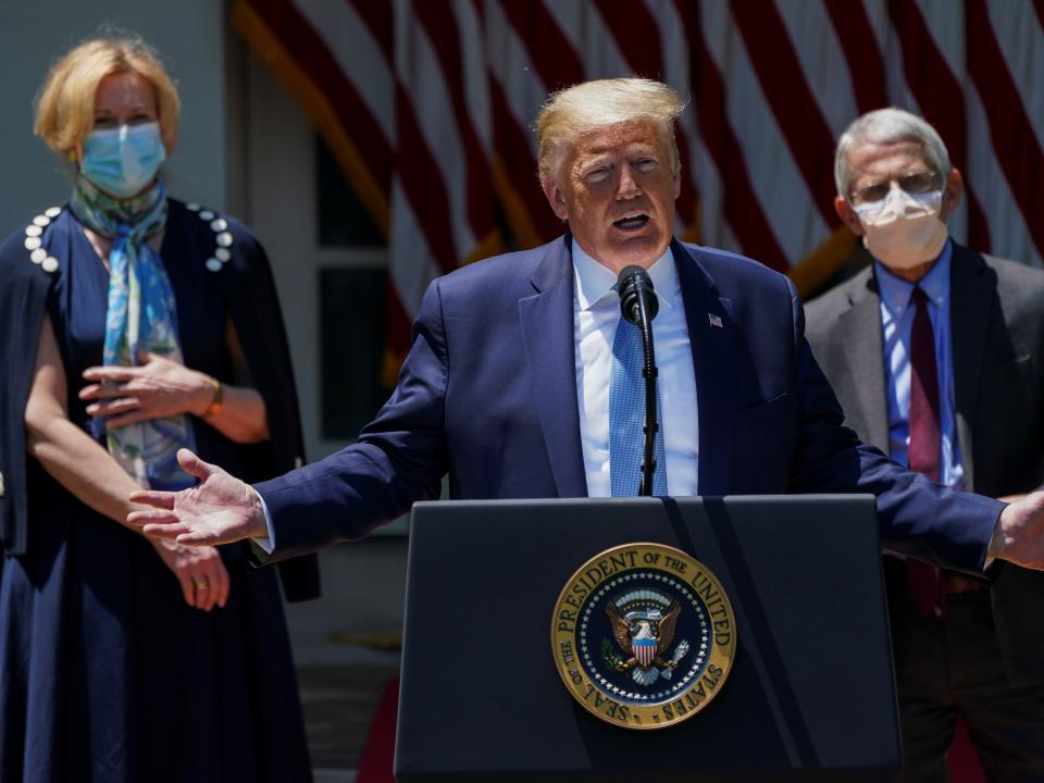 U.S. President Donald Trump speaks about administration efforts to develop a novel coronavirus vaccine as Dr. Debbie Birx, the White House coronavirus response coordinator, and National Institute of Allergy and Infectious Diseases Director Dr. Anthony Fauci listen during a coronavirus disease (COVID-19) pandemic response event in the Rose Garden at the White House in Washington, U.S., May 15, 2020. REUTERS/Kevin Lamarque