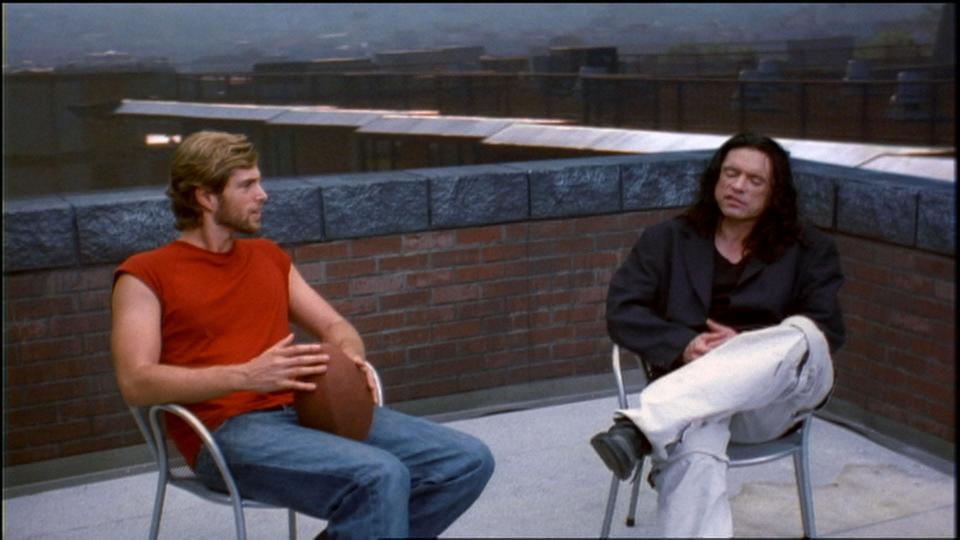 Greg Sestero as Mark (left) and Tommy Wiseau as Johnny in “The Room.”