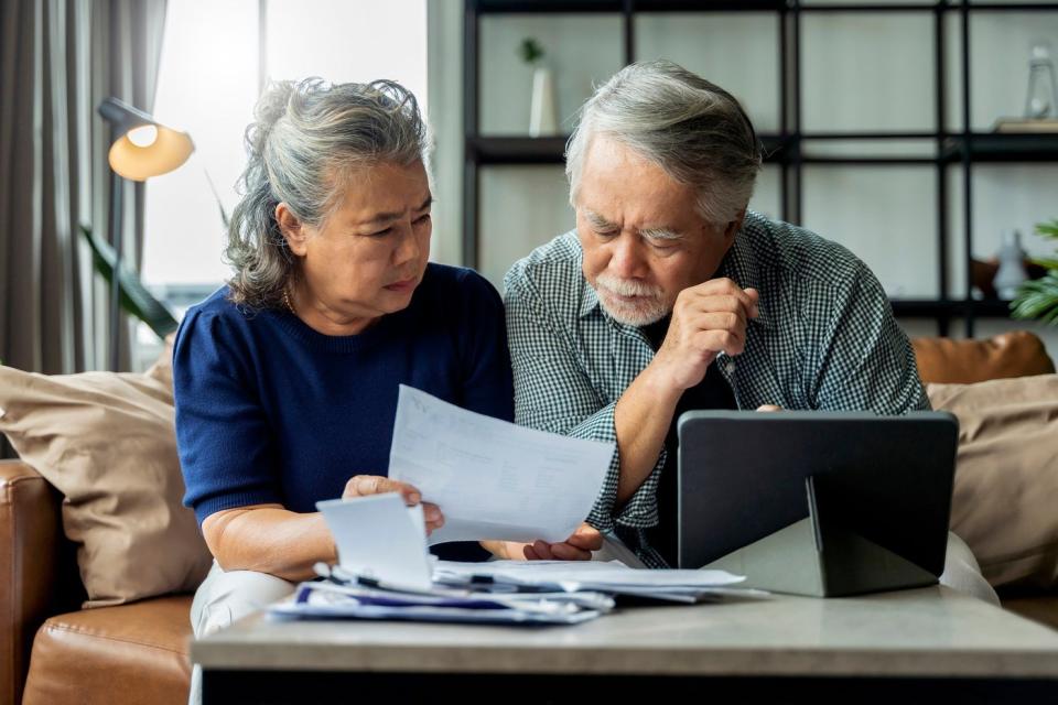 Two people looking at a document.