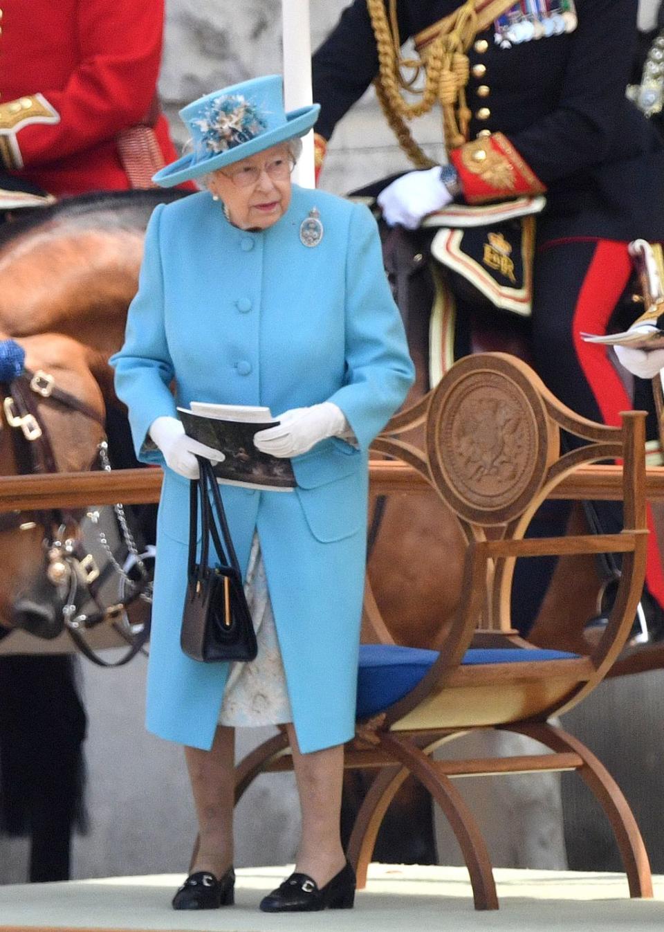 <p>The Queen takes her seat as the celebrations begin.</p>