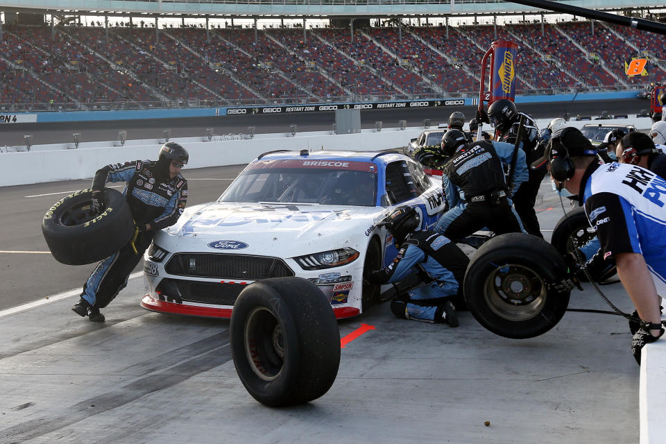 Chase Briscoe (98) makes a pit stop for tires and gas during a NASCAR Xfinity Series auto race at Phoenix Raceway, Saturday, Nov. 7, 2020, in Avondale, Ariz. (AP Photo/Ralph Freso)