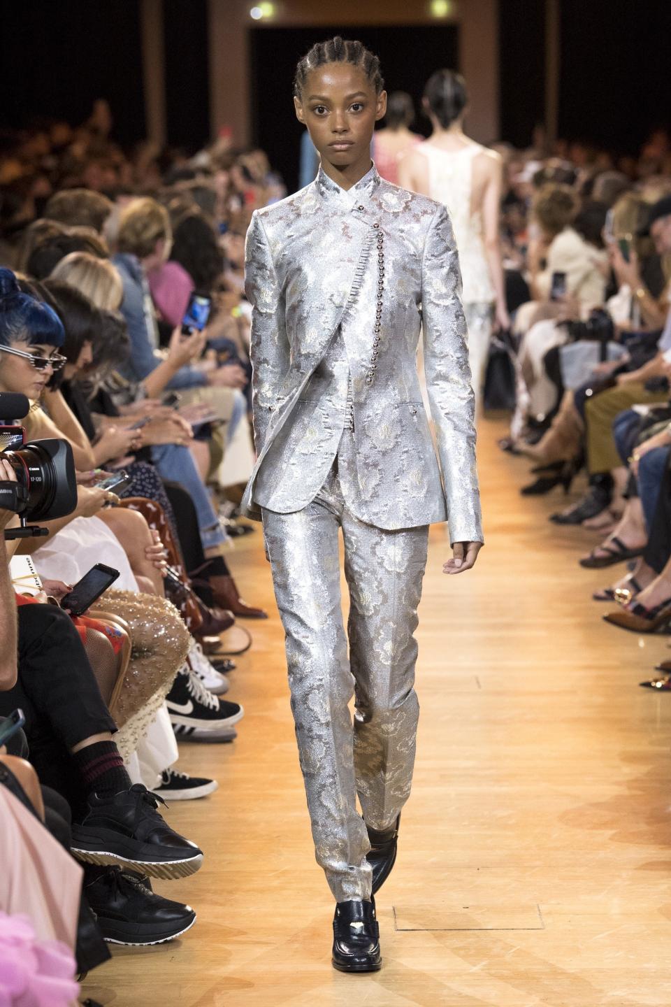 Paco Rabanne’s metallic silver suit borrows from the boys (in a capital-F fabulous way).