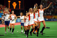 BEIJING - AUGUST 22: Naomi Van As #18 and Sophie Polkamp #21 of the Netherlands celebrate after their 2-0 victory over China in the women's gold medal hockey match at the Olympic Green Hockey Field on Day 14 of the Beijing 2008 Olympic Games on August 22, 2008 in Beijing, China. (Photo by Lars Baron/Bongarts/Getty Images)
