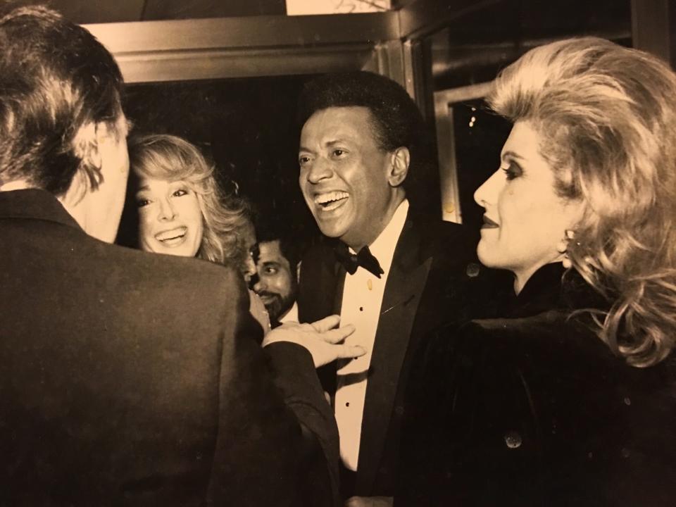 Donald Trump (left) and E. Jean Carroll (second from left, with then-husband John Johnson) in a photograph Carroll says dates from a 1987 party they attended.