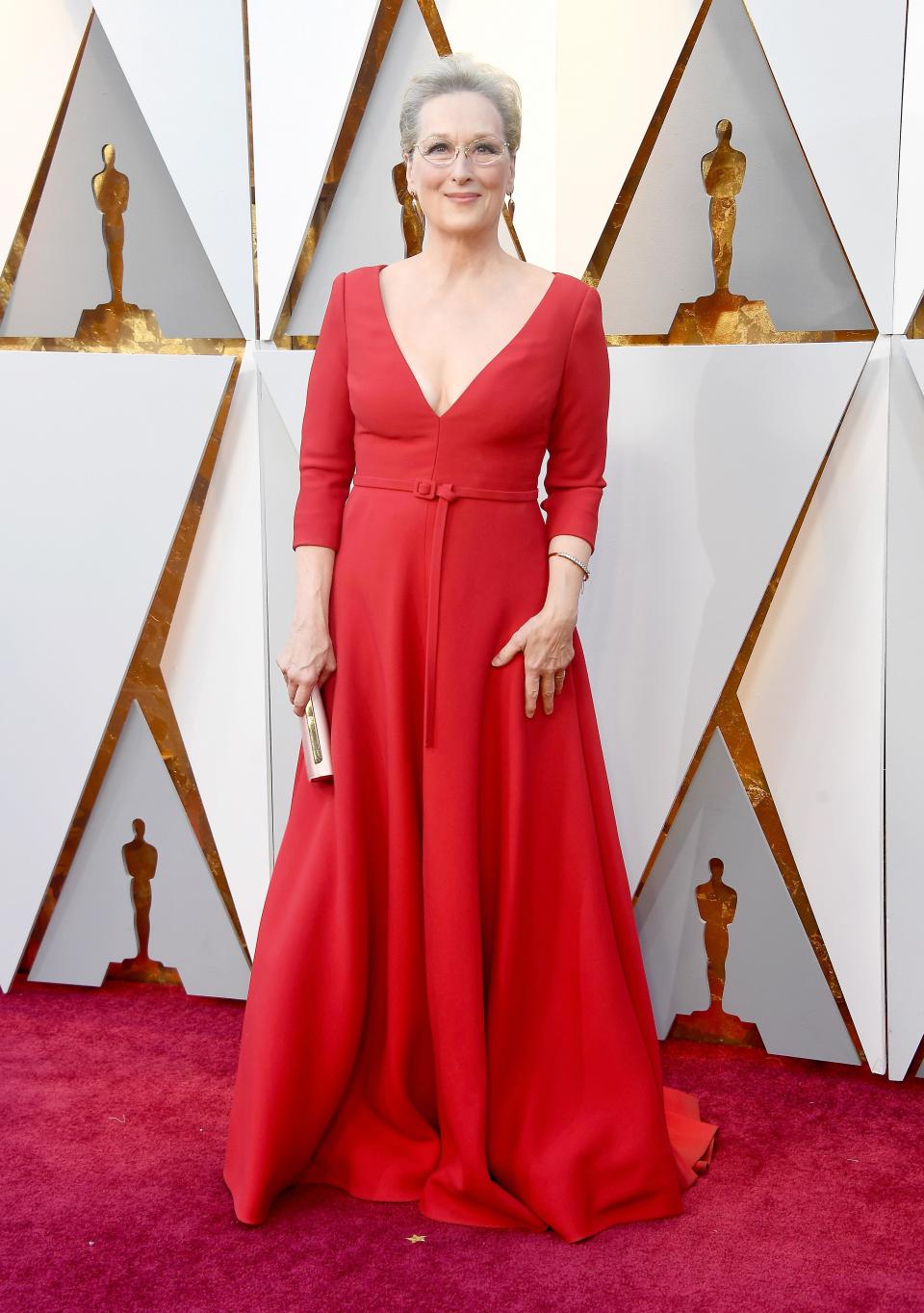 <p>Meryl Streep wears a gorgeous red floor-length gown.</p>