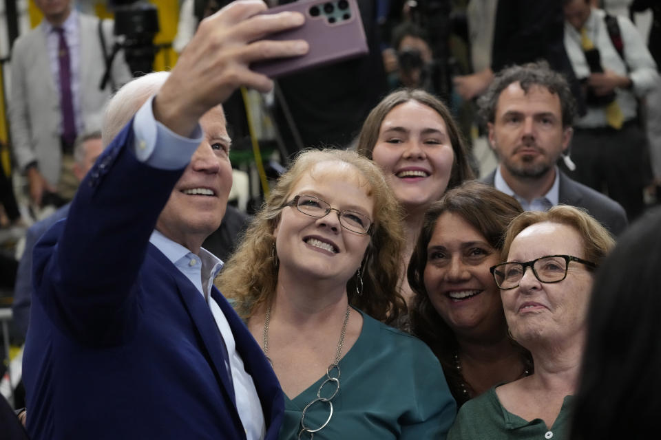 President Joe Biden takes a selfie with supporters in the audience after speaking at the Arcosa Wind Towers, Wednesday, Aug. 9, 2023, in Belen, N.M. (AP Photo/Alex Brandon)