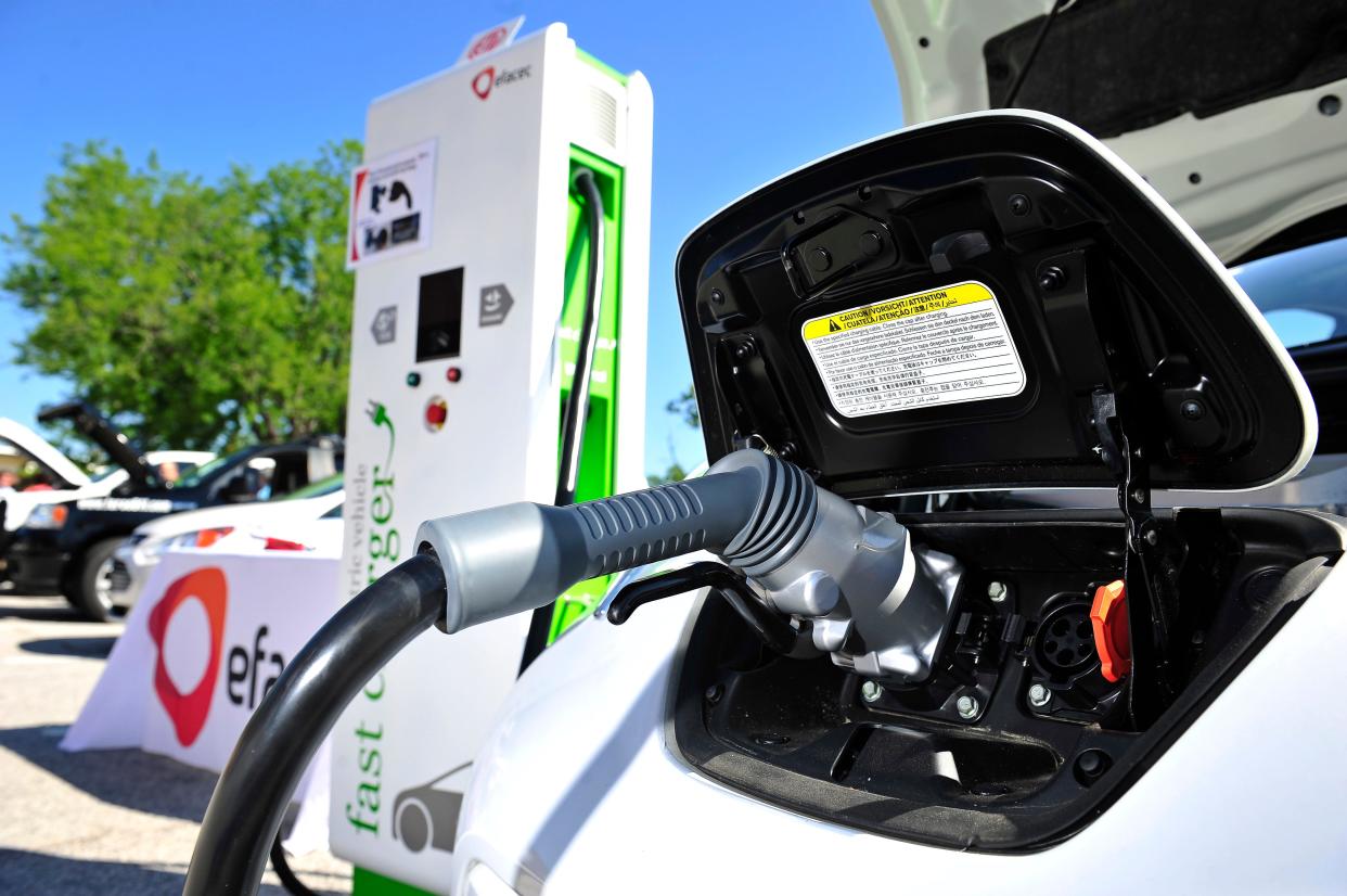 An electric vehicle charger is plugged in to a Nissan Leaf at the Georgia Alternative Fueled Vehicle Roadshow in Augusta, in this photo from 2013. A similar charger stood at the center of a Grovetown dispute involving Energy Secretary Jennifer Granholm.