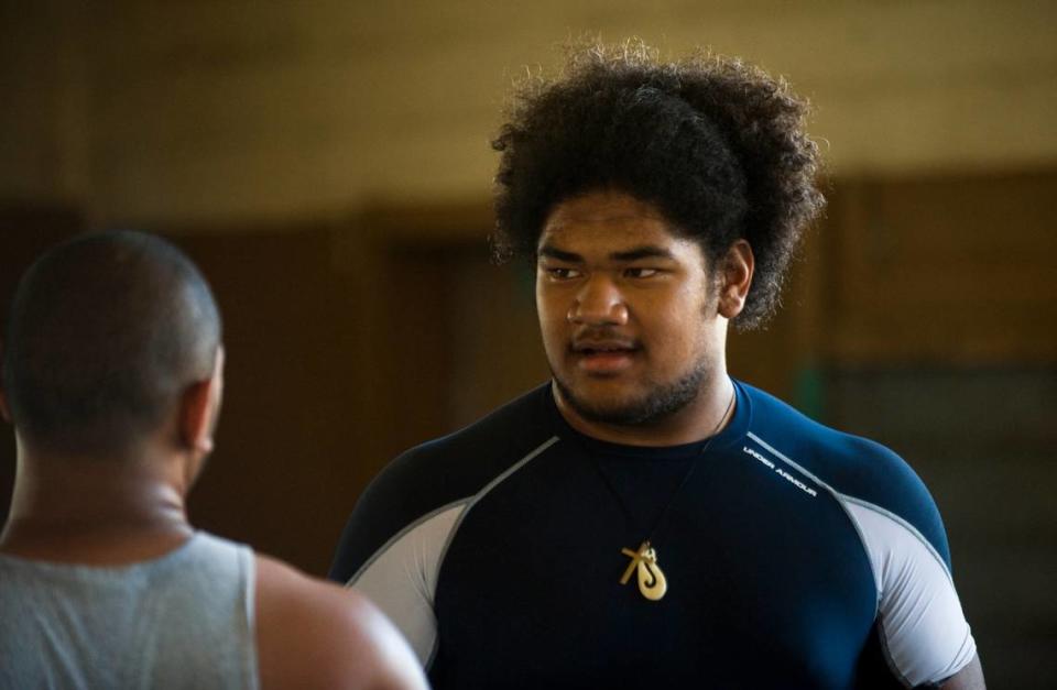 Grant High School football lineman Vei Moala works out before practice in 2009, as his team hopes to repeat a 14-0 season.
