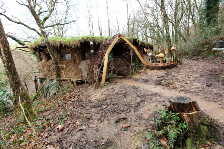 The hut is made out of tree trunks, straw and mud (SWNS)