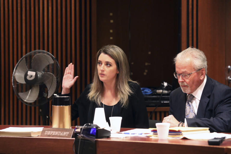 Kate McClure, 29, charged with theft by deception in the $400K GoFundMe scam, with her lawyer Jim Gerrow Jr., pleads guilty before State Superior Court Judge Christopher Garrenger in Burlington County Courthouse, Mt. Holly, N.J., Monday April 15, 2019. (David Swanson/The Philadelphia Inquirer via AP)