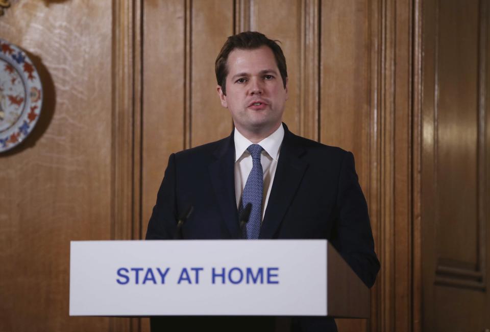 Britain's Housing, Communities and Local Government Secretary Robert Jenrick speaks during a daily COVID 19 coronavirus press briefing to announce new measures to limit the spread of the virus, at Downing Street in London Sunday March 22, 2020.  For some people the COVID-19 coronavirus causes mild or moderate symptoms, but for some it can cause severe illness including pneumonia. (Ian Vogler / Pool via AP)