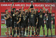 New Zealand's players celebrate after they beat the U.S. in the final match of the Emirates Airline Rugby Sevens in Dubai, the United Arab Emirates, Saturday, Dec. 1, 2018. (AP Photo/Kamran Jebreili)