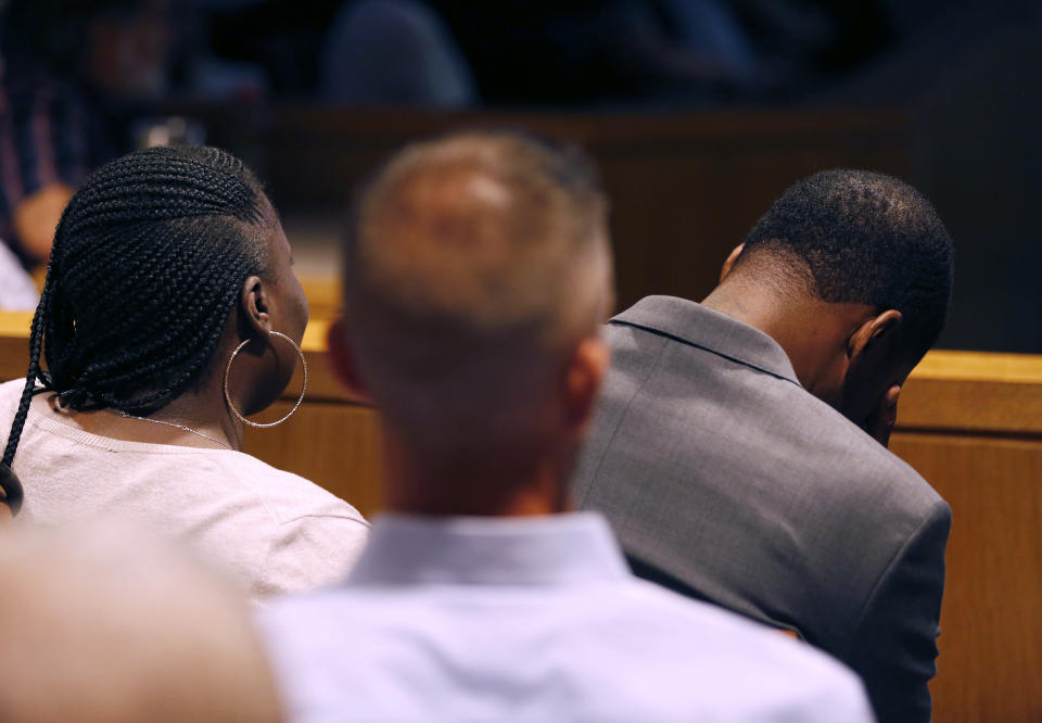 Odell Edwards, father of Jordan Edwards, drops his head to avoid seeing a crime scene photo during a closing argument in the trial of former Balch Springs police officer Roy Oliver, who is charged with the murder of 15-year-old Jordan Edwards, at the Frank Crowley Courts Building in Dallas on Monday, Aug. 27, 2018. (Rose Baca/The Dallas Morning News via AP, Pool)