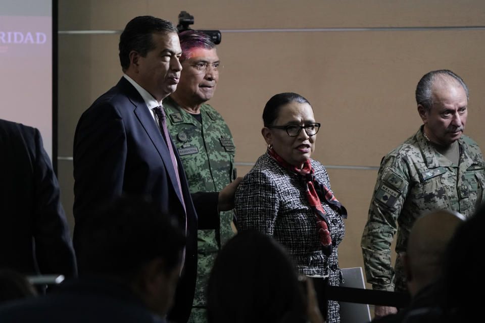 Mexican Public Safety Secretary Rosa Icela Rodriguez, center, and Mexican Defense Secretary Luis Cresencio Sandoval, back left, leave after giving a news conference announcing the arrest of Ovidio in Mexico City, Thursday, Jan. 5, 2023. Mexican security forces captured Ovidio Guzmán, an alleged drug trafficker wanted by the United States and one of the sons of former Sinaloa cartel boss Joaquín "El Chapo" Guzmán, Thursday in a pre-dawn operation outside Culiacan. (AP Photo/Eduardo Verdugo)