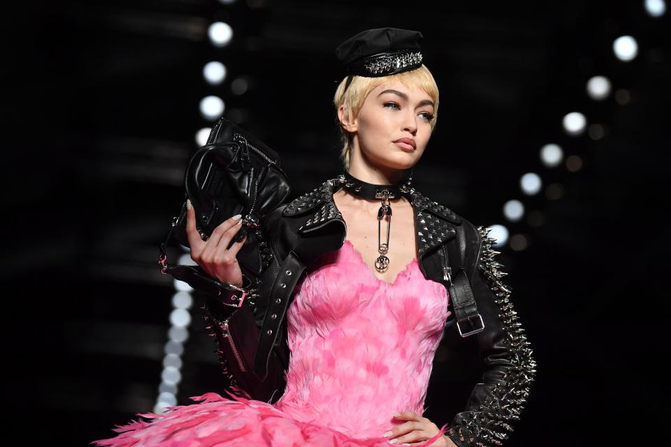 Model Gigi Hadid wears feathers at a Moschino runway show in September&nbsp;2017. (Photo: AFP Contributor via Getty Images)