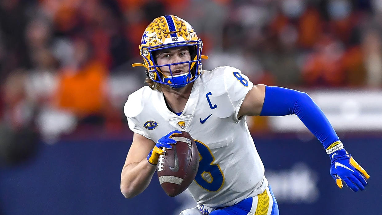 Pittsburgh quarterback Kenny Pickett looks to pass against Syracuse during the first half of an NCAA college football game in Syracuse, N.Y., Saturday, Nov. 27, 2021. (AP Photo/Adrian Kraus)