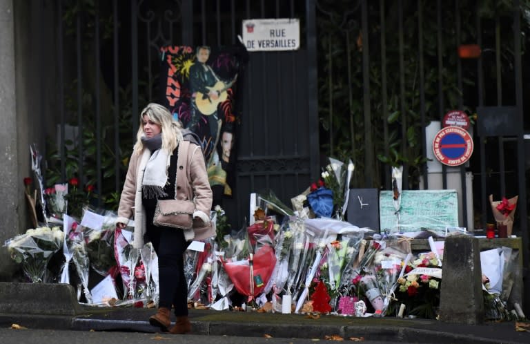 Fans deposed flowers outside the home of French rocker Johnny Hallyday in Marnes-la-Coquette, outside Paris, on Thursday